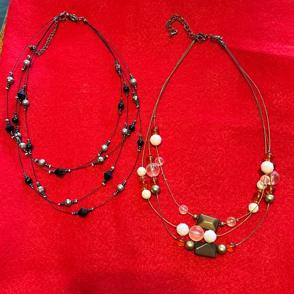 Women’s pair of beaded 3 and 4 strands necklaces, 1 gold and 1 black